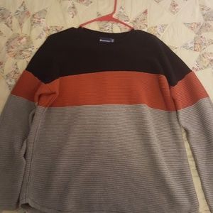 A lightly worn sweater.